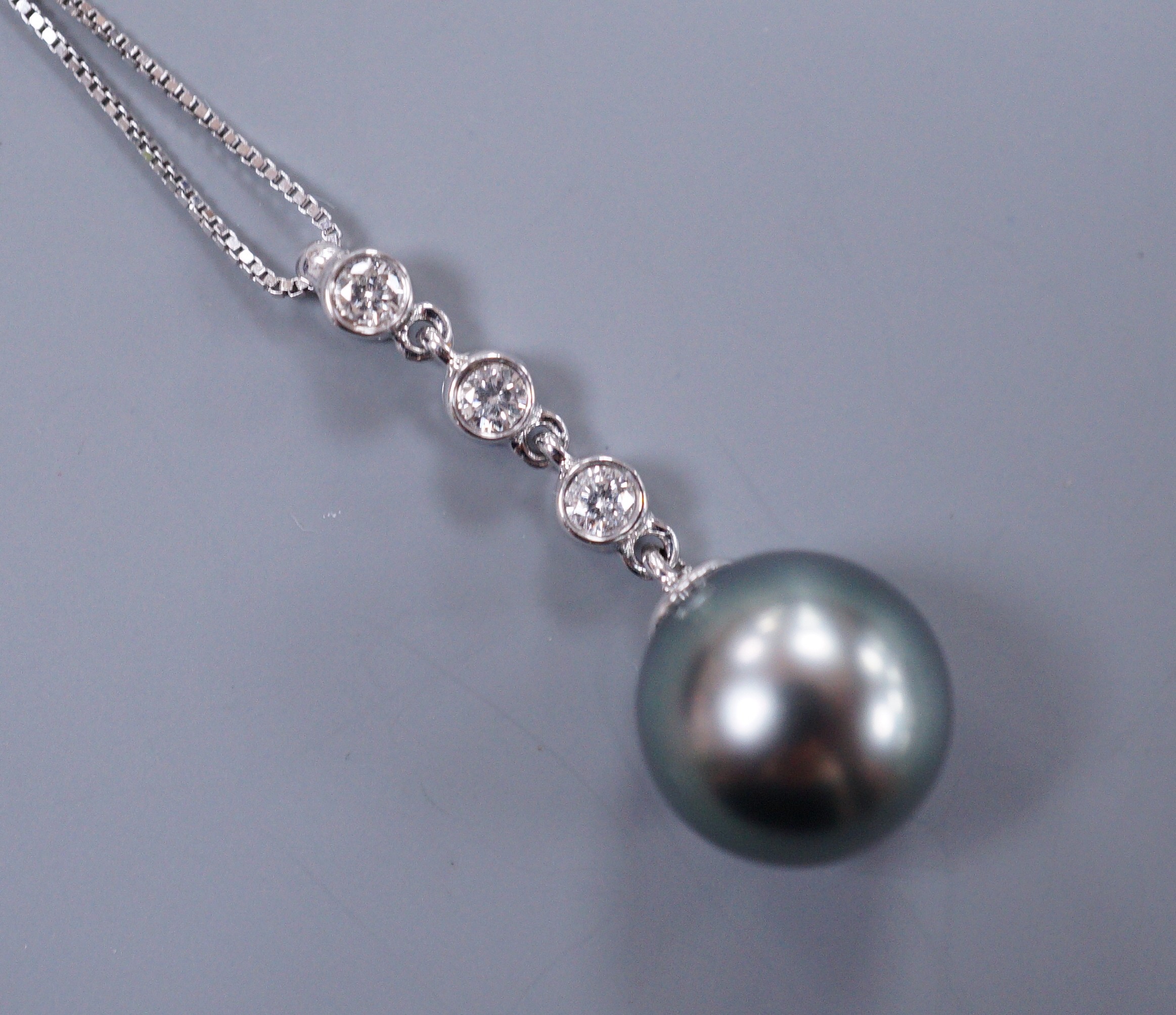 An Iliana 18ct white gold Tahitian pearl and diamond drop pendant, with original guarantee card and box